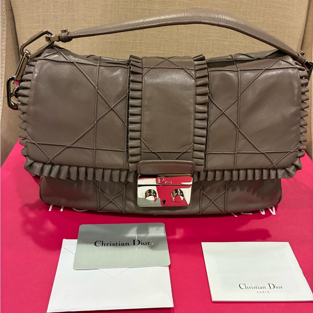 Christian Dior light mauve quilted shoulder bag with silver hardware.